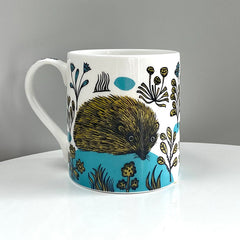 Lush designs mug with hedgehog print in turquoise and yellow